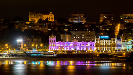 SANTANDER, SPAIN - AUGUST 29, 2015: Panoramic view of Great Casino of Santander city iluminated at night and reflections in the water of the beach Cantabria, Spainのeditorial素材