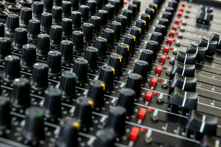 Detail of the buttons and controls on an vintage miximg console