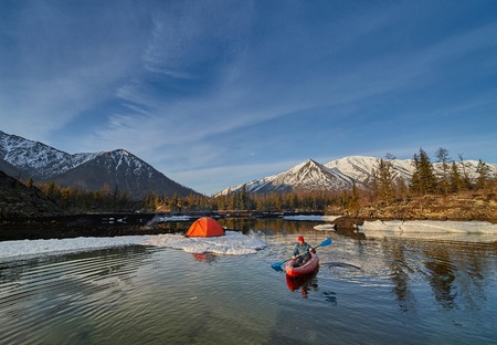 Man paddling kayak in mountain lake. Freedom.の写真素材