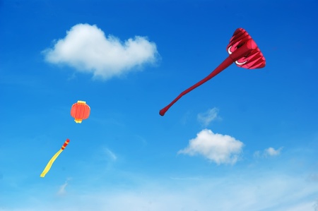 Colorful kites flying in the skyの写真素材