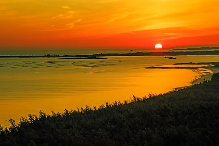 Sunrise over sea in Hainan Island, Chinaの写真素材
