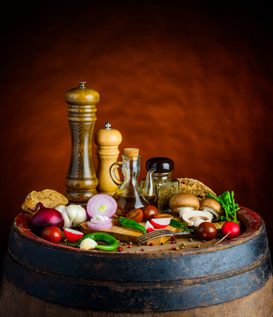 fresh vegtables, olive-oil on rustic background in still lifeの写真素材