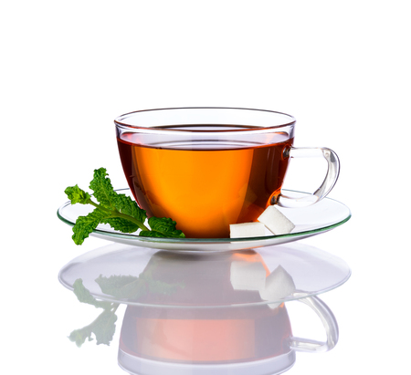 Cup of Mint tea isolated on white background and green leavesの写真素材