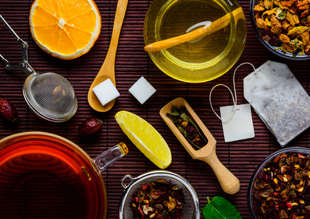 Table Top full with Tea, Tea-Ingredients and sweetenersの写真素材