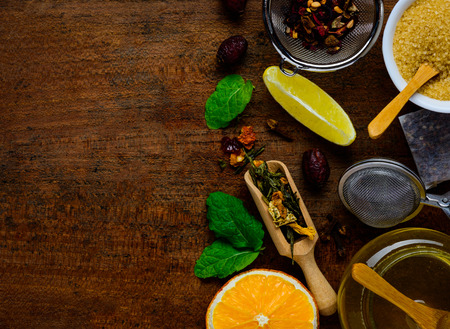 Top-view of tea-ingredients on a wooden Table-topの写真素材