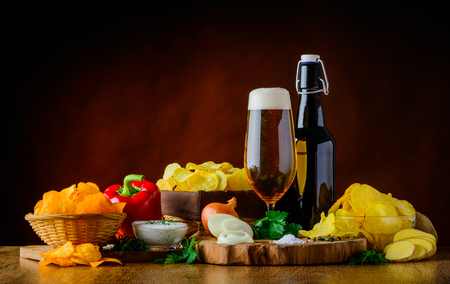 Potato-Chips ingredients with glass and bottle beerの写真素材