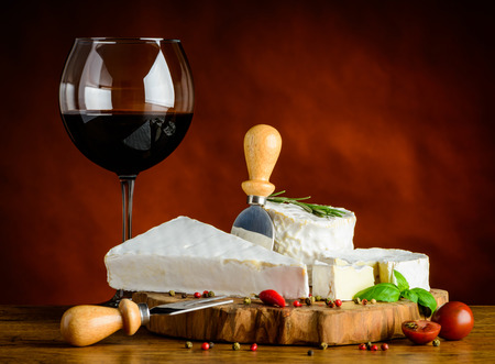 Soft Cheese food with glass of red wine drinkの写真素材