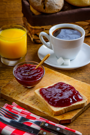 Breakfast Food with red fruit  jam on sliced breadの写真素材