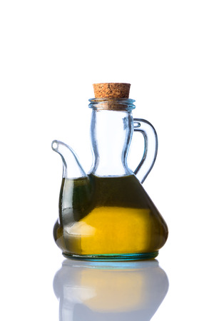 One rustic bottle of Cooking olive oil isolated on white background with reflectionの写真素材