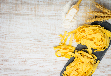 Yellow Tagliatelle Pasta with copy space. Italian Foodの写真素材