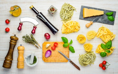 Mediterranean Cuisine Food with Tagliatelle and Tagliolini and Parmigiano Reggiano Parmesan Cheese and Seasoningsの写真素材
