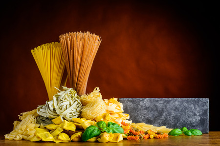 Italian Pasta with copy space. Italian cuisine food with Spaghetti, tagliatelle, tortelini and fusilli doppia rigaturaの写真素材