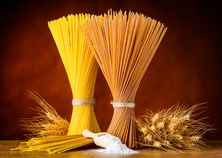 Yellow and Brown Italian Spaghetti with Flour and Wheat.の写真素材
