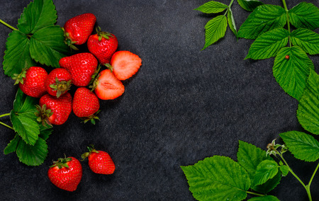 Fresh Red Strawberries with Green leaves and Copy Space Area