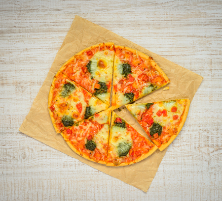 Italian Cuisine Fast Food Pizza sliced. Top view on a white backgroundの写真素材