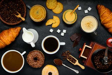 Cups of Coffee and Cappuccino with Donuts and Croissantの写真素材