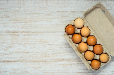 Egg Carton Box with Organic Chicken Eggs and on Copy Space Areaの写真素材