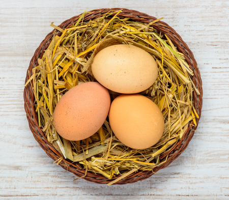 Organic and Good Looking Chicken Eggs in Straw nestの写真素材