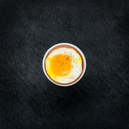 Boiled Organic Chicken Egg on Dark Backgroundの写真素材