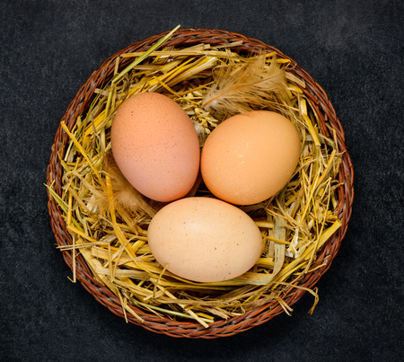 Natural Chicken Nest with Organic Eggs in Top Viewの写真素材