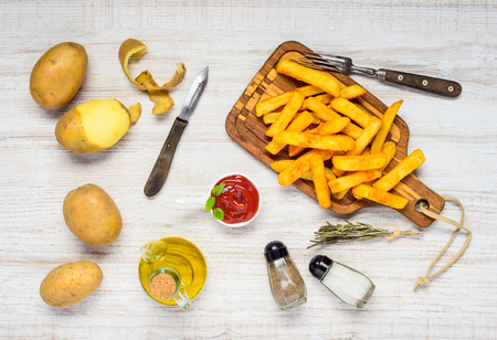 French Fries with Cooking Ingredients and Potatoes, Salt and Pepperの写真素材