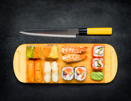 Japanese Sushi Knife with rolls, Sashimi, Nigiri and Wasabiの写真素材
