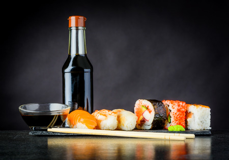 Sushi Rolls with Rice, Surimi and Smoked Salmon and Soy Sauceの写真素材