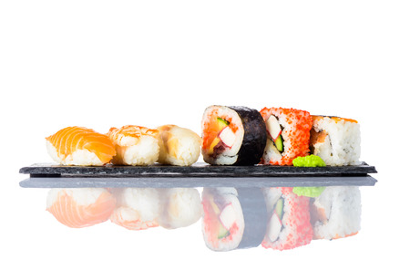 Different types of sushi rolls with Smoked Salmon, surimi and Rice on White Backgroundの写真素材
