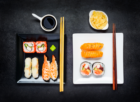 Two Plates, Black and White with Japanese Food Sushi, Soy sauce and Gingerの写真素材