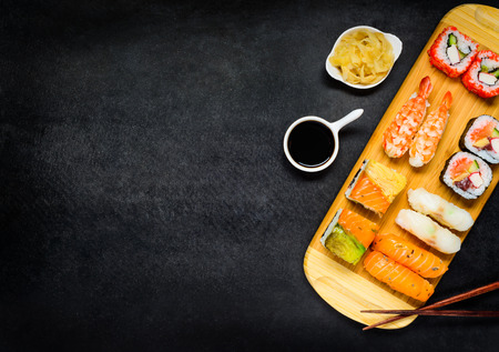 Sushi Rolls with Soya Sauce and Tsukemono gari and Chopsticks on Copy Space Areaの写真素材