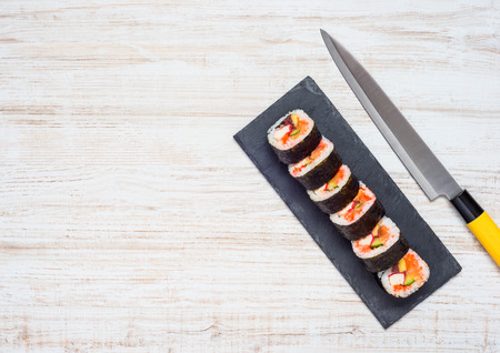 Japanese Sliced Sushi Rolls with Knife and Copy Space Areaの写真素材