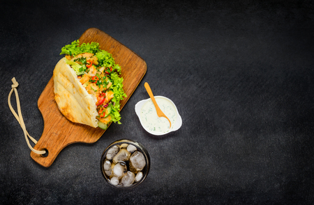 Turkish Doner Kebab Sandwich with Cold Ice Cola and Sauce on Copy Space Areaの写真素材