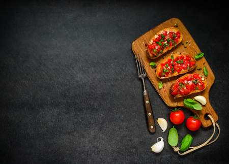 Italian Cuisine Food with Bruschetta Antipasto with Tomato and Basil on Copy Space Text Areaの写真素材