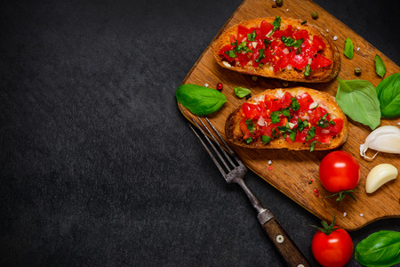 Italian Food Antipasto Bruschette with Fresh Tomato and Basil on Copy Space Text Areaの写真素材