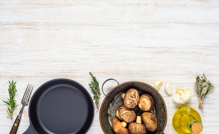 Top View of Mushrooms with Frying Pan and Olive Oil and Copy Space Areaの写真素材