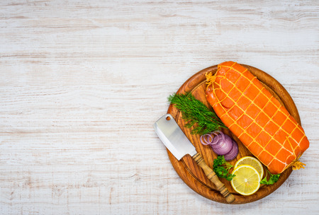 Red Smoked Salmon Fish with Onion and Lemon in Top Viewの写真素材