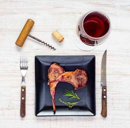 Lamb Chops Served as Dinner with Glass of Red Wine in Top Viewの写真素材
