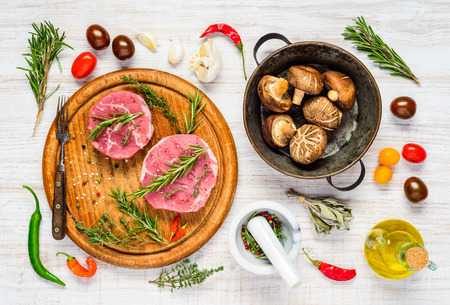 Top View of Raw Meat with Mushrooms and Cooking Ingredientsの写真素材