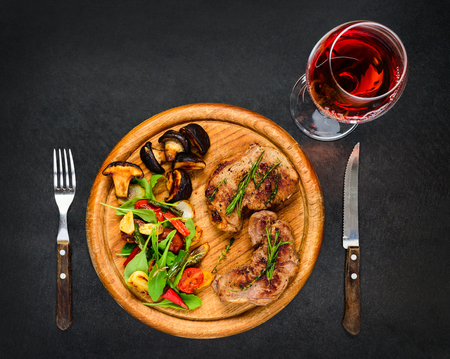 Grilled Steak Meat with Glass of Rose Wineの写真素材