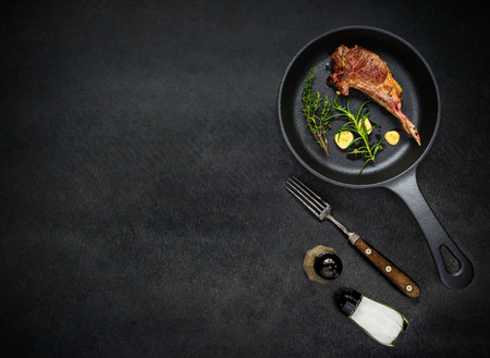 Copy Space Text Area with Grilled Lamb Steak Ribs and Condiments in Top Viewの写真素材