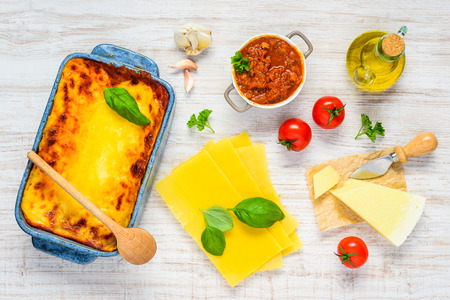 Top View of Italian Cuisine Food Lasagna Pasta with Cooking Ingredients, olive oil, sauce and Vegetablesの写真素材