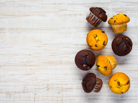 Copy Space Text Area with Yellow and Brown Muffins in Top Viewの写真素材