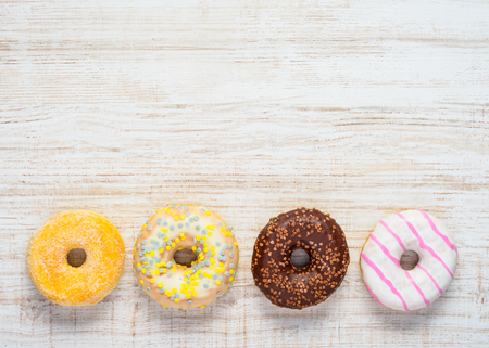 Different Types of Doughnuts Sweets in Top View and Copy Space Text Areaの写真素材