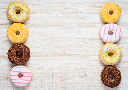 Copy Space Area with Different Types and Colors of Doughnuts Cakesの写真素材