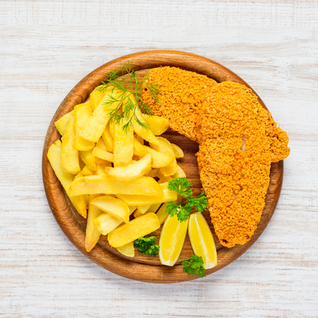 Fish and Chips Fried Potatoes with Baked Fish in Top Viewの写真素材