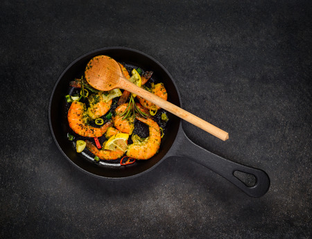 Top View of Cooked Shrimps and Prawns in Cooking pan with spices and Vegetables.の写真素材