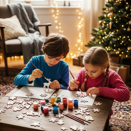 Two happy children are focused on painting wooden Christmas ornaments at a table in a cozy, festive living room setting. This creative holiday activity brings joy and warmth during the winter season.の素材