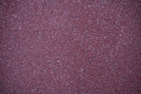 Background image of red asphalt pavement. Layer moisture protective surface treatment of the roadway. Covering a bike path. Asphalt texture. Road surface. Monotonous wallpapers.の写真素材