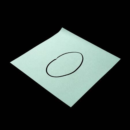 Paper sticker with the image of the letter o. Isolated object on a black background. Paper texture. Sticky note. A piece of paper for notes. Self-adhesive piece of paper.の写真素材