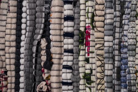 Texture of a multi-colored rug made from different fabricsの写真素材